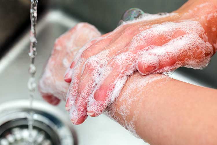 person washing hands to prevent Gastroenteritis Outbreak