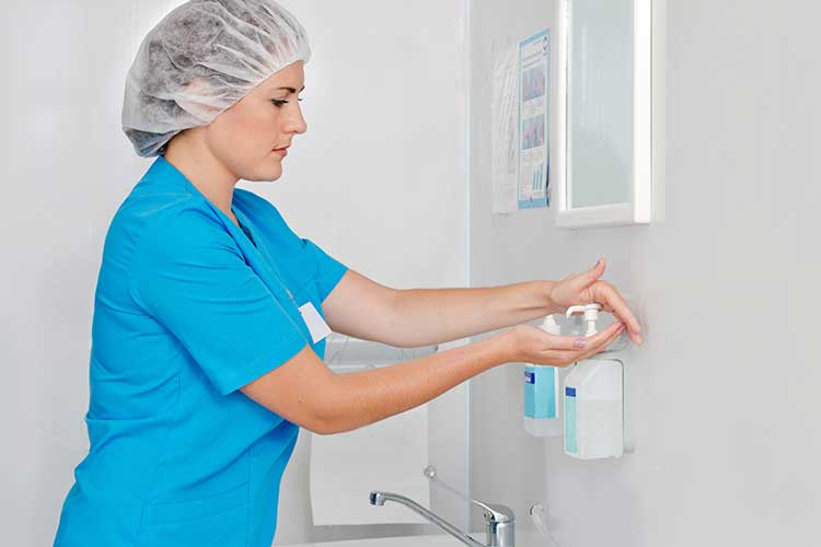 hand hygiene healthcare professional using hand rub