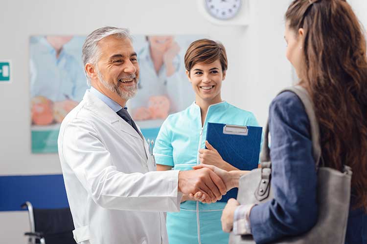 ndis service agreement participant shaking hands with provider staff